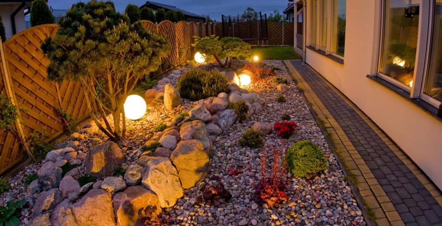 Home garden at night, illuminated by globe shaped lights. Decorative gardening and landscaping abstract. Lush May foliage.